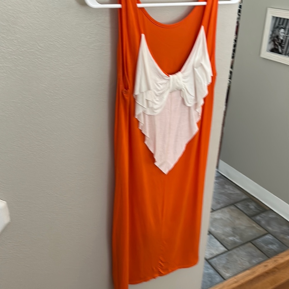 Orange and white medi length dress. From BLISS boutique in Knoxville.